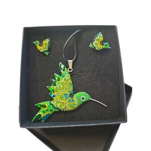 Rubylishious 
Silver set of earrings and pendant green humming bird shape with b